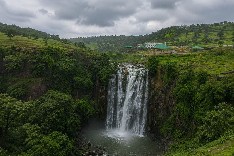 Patalpani waterfall flowing through green hills near Indore